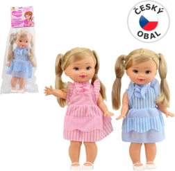 Puppe mit Zöpfen und Hosenträgern