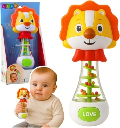 Babyrassel Löwe mit bunten Kügelchen