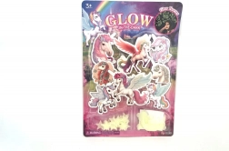 Leuchtende Einhörner im Dunkeln