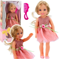 Puppe in rosa Kleidern mit Schleife und Kamm