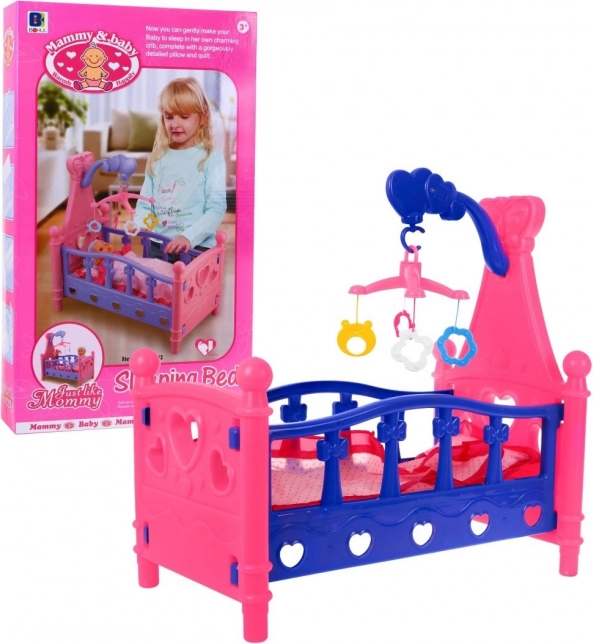 Puppenbett mit Mobile und Bettwäsche, 3+