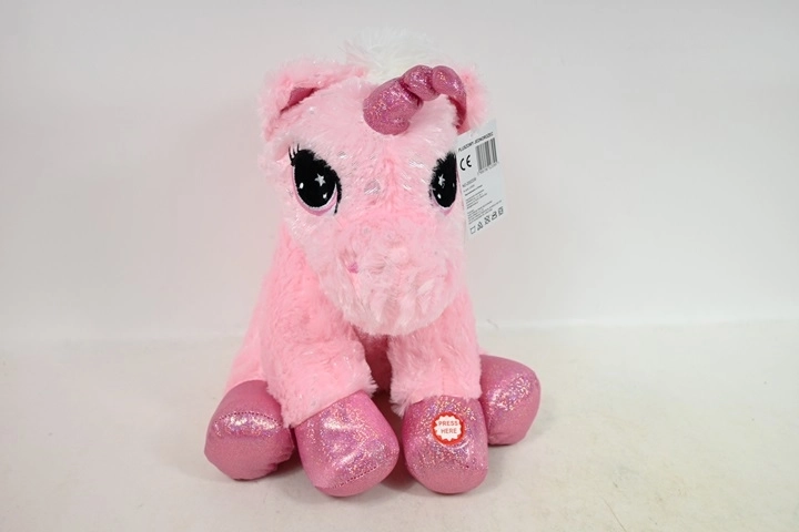 Sitzendes Plüsch-Einhorn mit Sound