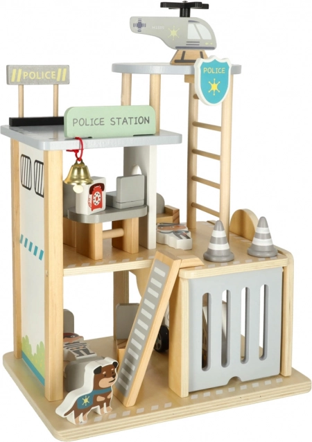 Hölzerne Polizeistation mit Garage, Auto und Hubschrauber