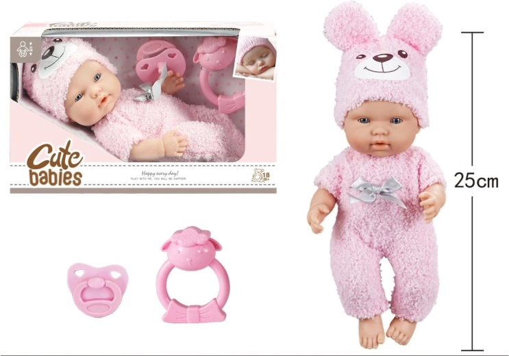 Baby mit Schnuller und Rassel im rosa Strampler