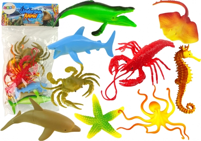 Set mit 9 Figuren von Meerestieren.