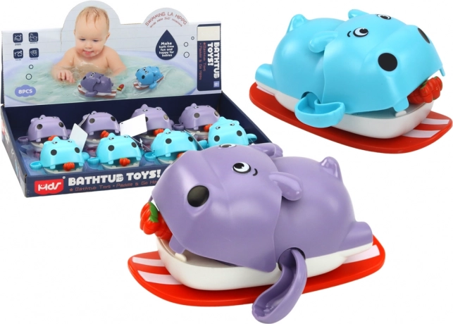 Aufziehbares Bade-Spielzeug – schwimmendes Nilpferd auf einem Brett