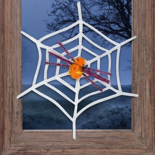 Weiße Halloween-Spinnwebe mit gelber Spinne