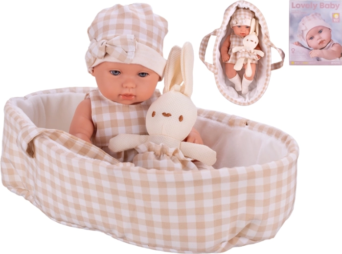 Puppe 33 cm mit festem Körper, Trage und Plüschhäschen