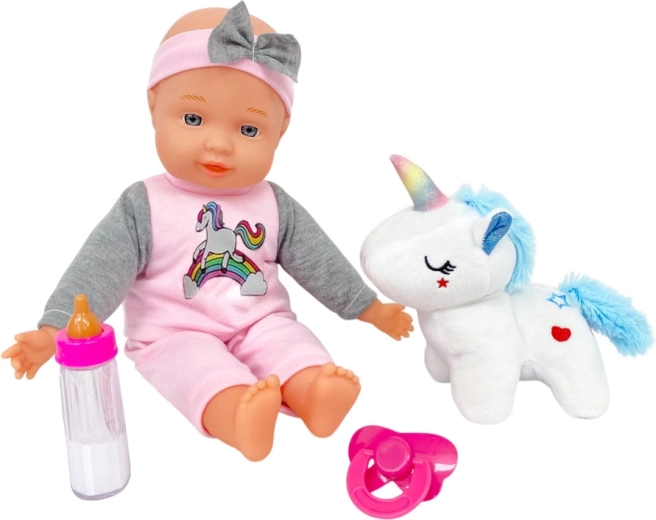 Baby mit Plüsch-Einhorn, 30 cm