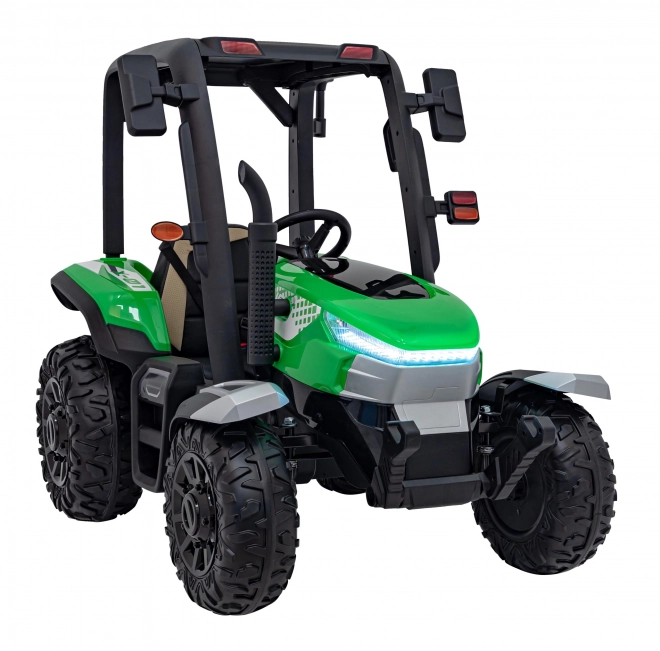 Kindertraktor mit grünem Anhänger