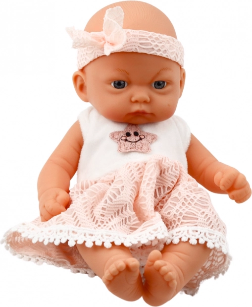 Babypuppe im rosa Kleid mit Haarband