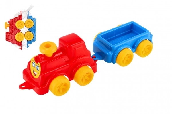 Bunte Kinderspielzeug-Lokomotive mit Waggon