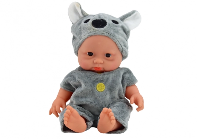 Niedliches Babypuppe mit Koala Mütze