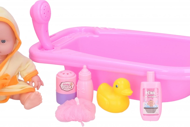 Baby mit Badewannenset