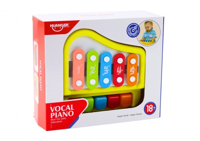 Gelbes Kinderxylophon und Mini-Klavier