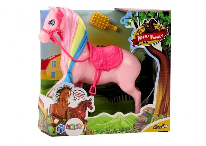 Pferdefigur mit bunter Mähne und rosa Sattel