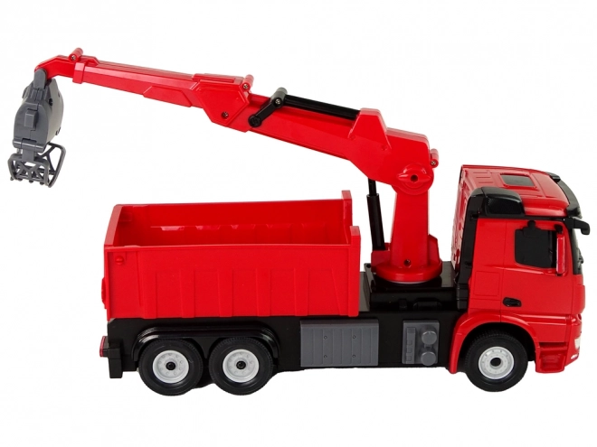 Rote Mercedes Rastar Greifarm-LKW