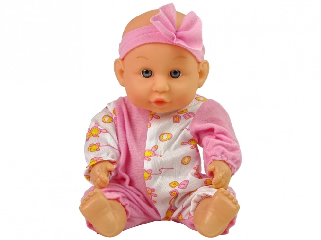 Baby-Puppe im rosa Pyjama mit Zubehör