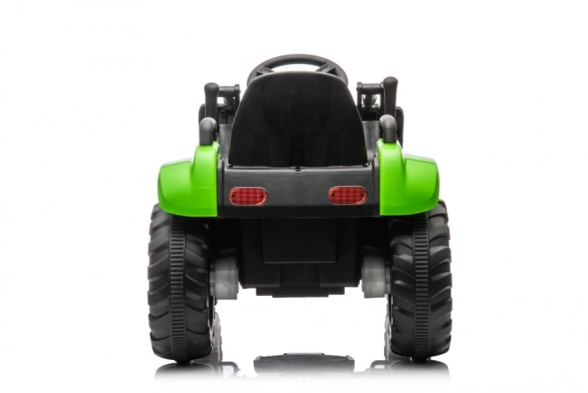 Elektrischer Kindertraktor mit funktionaler grüner Schaufel