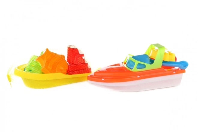 Spielzeugboot mit Sandspielset