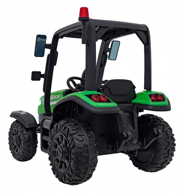Kindertraktor mit grünem Anhänger