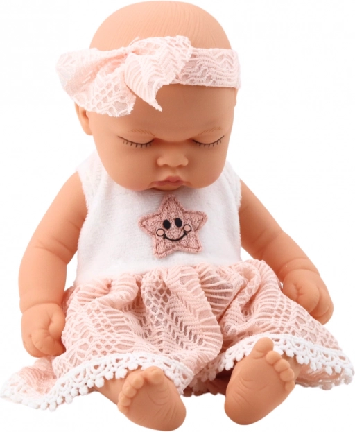 Schlafende Babypuppe in rosa Kleid mit Spitze und Sternstirnband