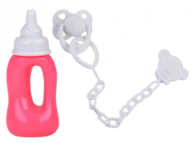 Gummipuppe Baby mit rosa Kleid