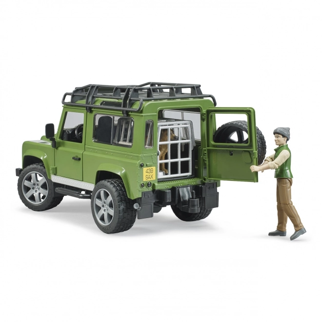 Bruder Land Rover Defender mit Jägerfigur, Hund und Zubehör