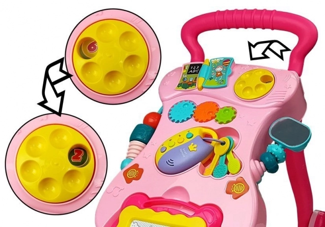 Pinker Baby Lauflernwagen mit Zaubertafel