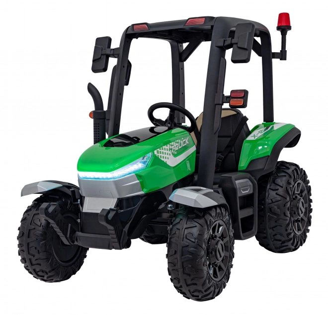 Kindertraktor mit grünem Anhänger