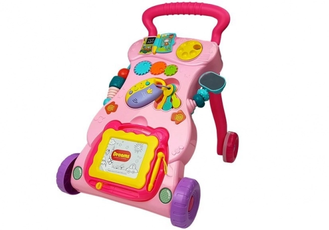 Pinker Baby Lauflernwagen mit Zaubertafel