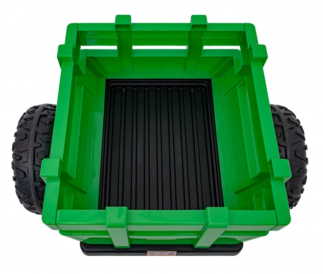 Kindertraktor mit grünem Anhänger