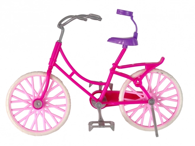 Puppe mit Fahrrad in Pink