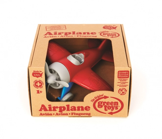 Grünes Flugzeugspielzeug Rot