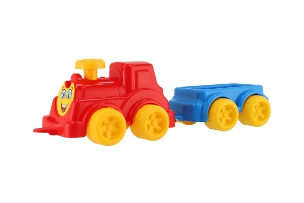 Bunte Kinderspielzeug-Lokomotive mit Waggon