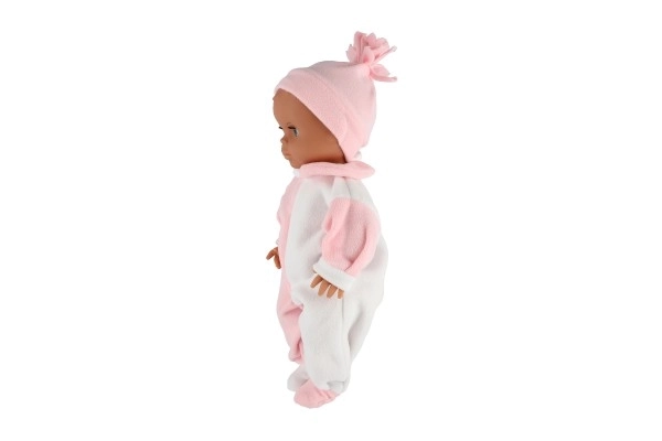 Süßes Hamiro-Baby mit festem Körper, weiß-rosa Overall und rosa Mütze