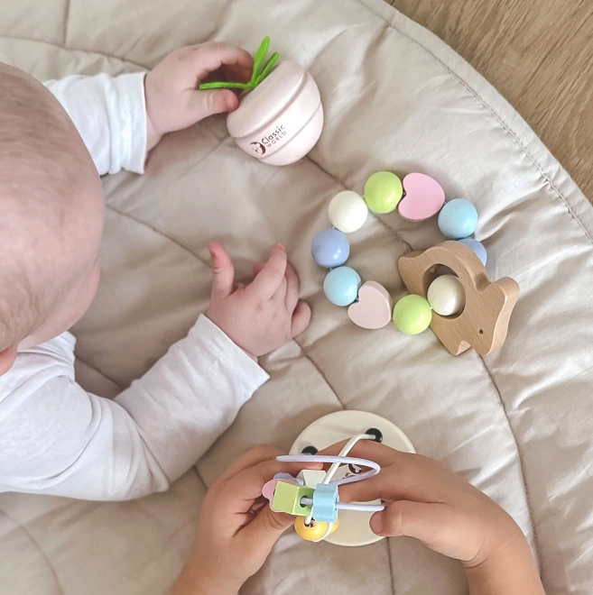 Pastellfarbenes Set aus motivierenden Babyspielzeugen Classic World