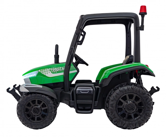 Kindertraktor mit grünem Anhänger
