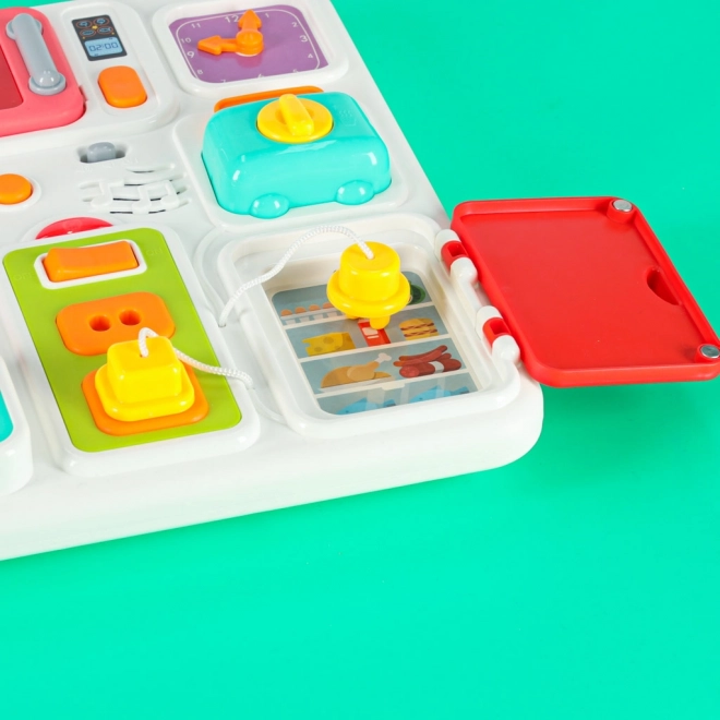Montessori Manipulationsbrett mit Küchenelementen und lernender Uhr