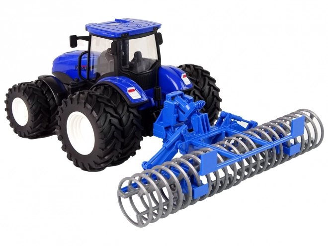 Ferngesteuerter Traktor mit Scheibenegge Metall Blau im Maßstab 1:24