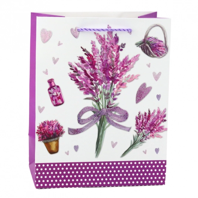Papiergeschenktasche mit Lavendelmotiv und glitzernden Elementen