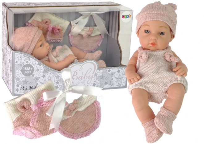 Süßes Babypuppe mit Strickpullover und rosa Mütze 30 cm