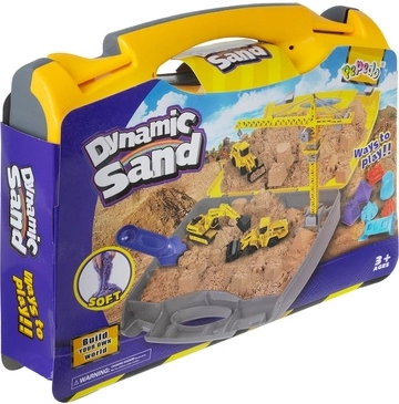 Koffer, der sich in eine Sandkiste verwandelt