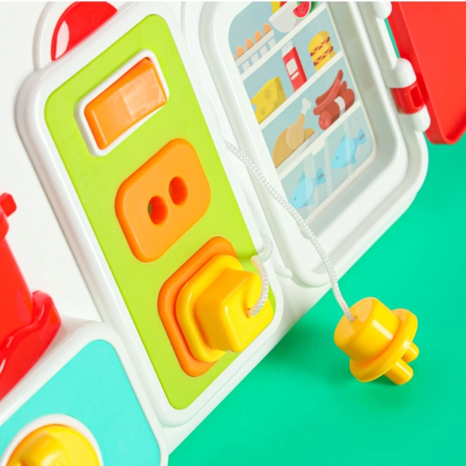 Montessori Manipulationsbrett mit Küchenelementen und lernender Uhr