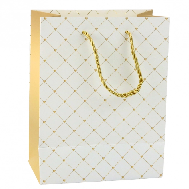 Papiergeschenktüte mit glänzenden Herzchen