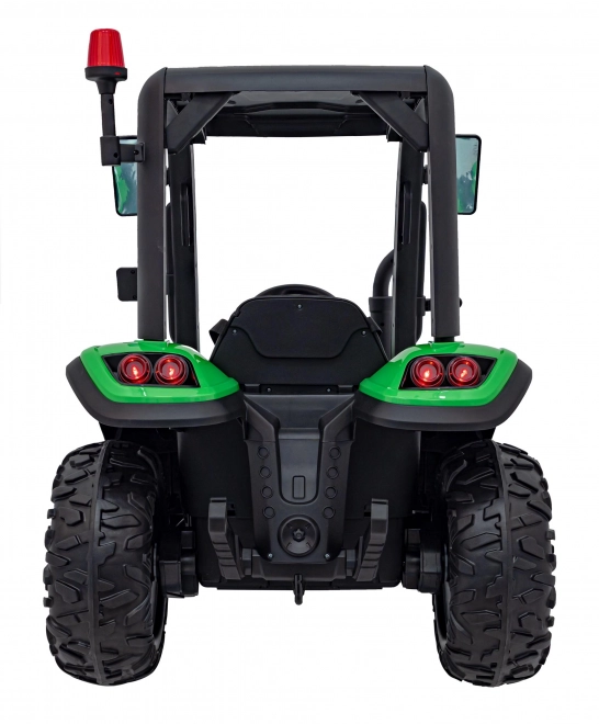 Kindertraktor mit grünem Anhänger