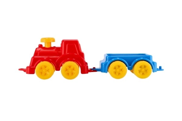 Bunte Kinderspielzeug-Lokomotive mit Waggon