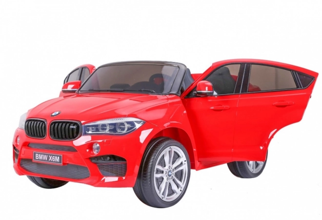 BMW X6M XXL pro 2 Kinder Rot + Fernbedienung + Ökoleder + Sicherheitsgurte + Langsamer Start + MP3 USB + LED-Leuchte