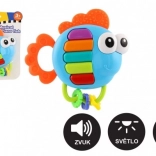 Musik-Rassel und Beißring in Fischform mit Licht und Sound, 14 × 14 cm, ab 3 Monaten