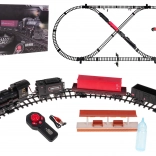 Eisenbahnstrecke mit rauchender Lokomotive, Licht und Musik